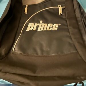 Prince Black Sporty Backpack with Glossy Finish . To store and carry racquet bal